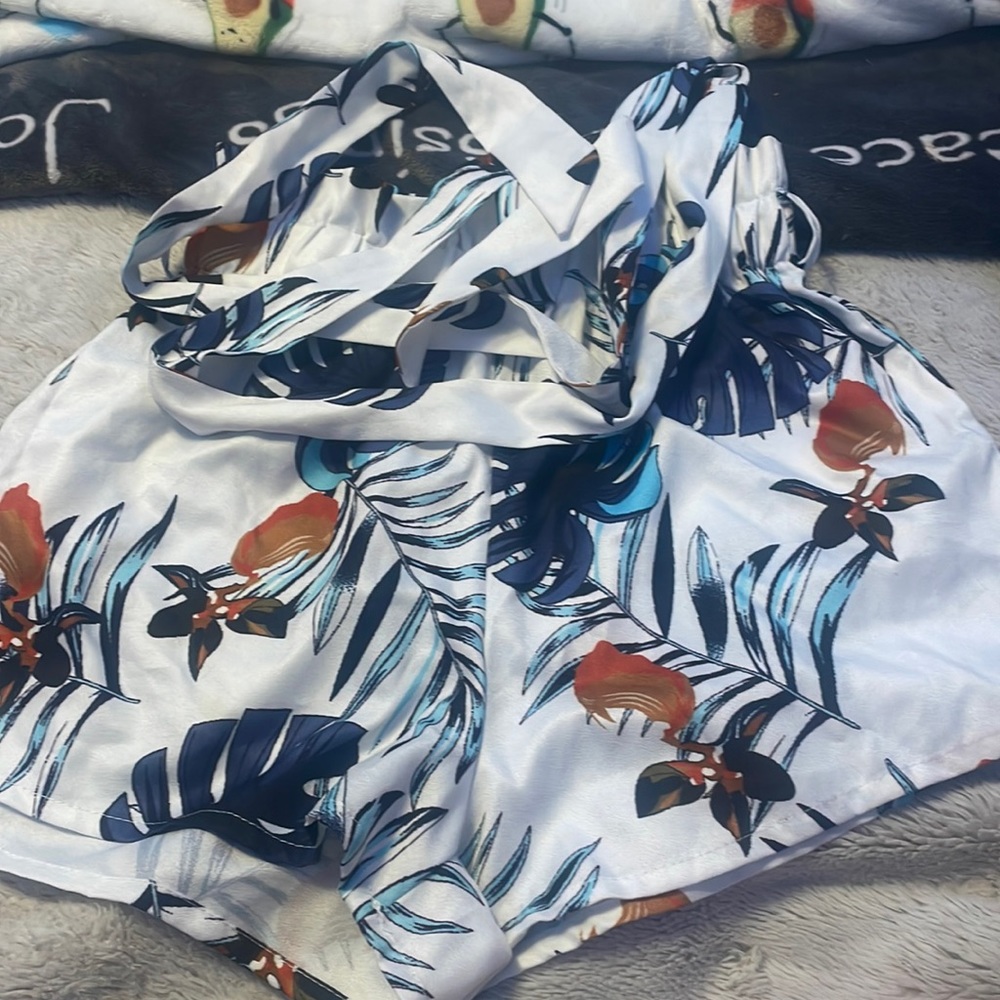 white with blue and yellow/orange leafs on it shorts, size small